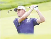  ??  ?? American Justin Thomas had a banner day at the U.S. Open. His 5-under 65, good enough for the top of the leaderboar­d, marked a U.S. Open record at Winged Foot.