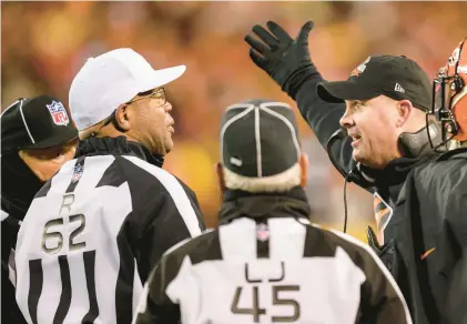  ?? REED HOFFMANN/AP ?? Bengals head coach Zac Taylor argues a call with referee Ronald Torbert (62) during the second half of the AFC Championsh­ip game against the Chiefs on Sunday in Kansas City, Missouri.