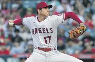  ?? Alex Gallardo Associated Press ?? SHOHEI OHTANI struggled with his first three batters but settled in and grinded through the rest of his outing against Texas. It was his ninth start with double-digit strikeouts this season.
