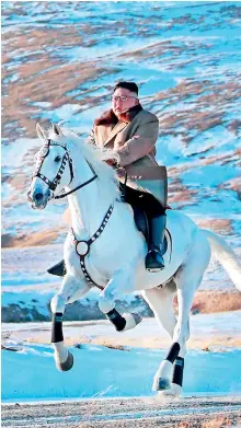  ??  ?? This undated picture released by Korean Central News Agency shows North Korean leader Kim Jong Un riding a white horse amongst the first snow at Mouth Paektu. (Photo by STR / KCNA VIA KNS / AFP) .