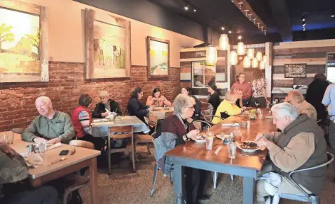  ?? PHOTOS BY STAN CARROLL / THE COMMERCIAL APPEAL ?? Diners enjoy lunch on March 16 at Pharm2Fork in Colliervil­le.