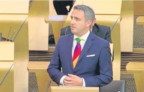  ??  ?? Ahead of the ministeria­l statement an MSP was sent out of Holyrood’s chamber for wearing a rainbow-coloured tie in support of the campaign.