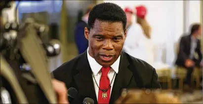  ?? JASON GETZ/JASON.GETZ@AJC.COM ?? Herschel Walker spoke to media Tuesday after his primary win. Asked whether there should be new gun laws in the wake of the Texas elementary school shooting, Walker said, “What I like to do is see it and everything and stuff.”