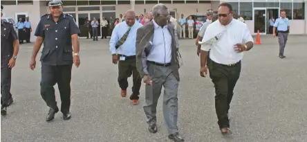  ??  ?? Solomon Islands Deputy Prime Minister Manasseh Maelanga, right, accompanie­s PM Manasseh Sogavare to board his flight.