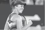  ?? ANDY WONG/AP ?? Linda Noskova celebrates Saturday after defeating Iga Swiatek in the third round of the Australian Open. Noskova won 3-6, 6-3, 6-4 to end Swiatek’s 18-match win streak.