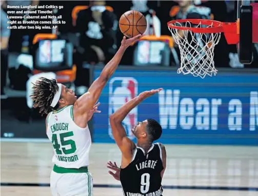  ??  ?? Romeo Langford and Celtics go over and around Timothe Luwawu-Cabarrot and Nets all night as Brooklyn comes back to earth after two big wins. AP