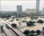  ?? REUTERS ?? Tropical storm Harvey has left downtown Houston flooded.