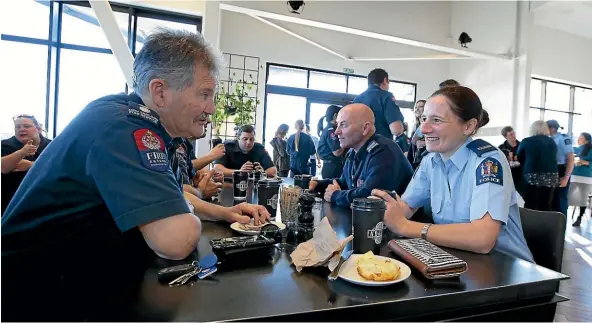  ?? ROBYN EDIE/STUFF ?? Senior Station fire officer Neil Ladbrook, Murray Milne-Maresca, back, and police constable Jess Double at the Cuppa with a Coppa event.