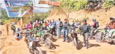  ??  ?? The bikers prepare for the one- and-a-half hour journey on dirt road from a junction off Jagoi Babang to Sebujit