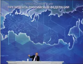  ?? ALEXANDER ZEMLIANICH­ENKO — THE ASSOCIATED PRESS ?? Russian President Vladimir Putin gestures while speaking during his annual news conference in Moscow on Thursday.