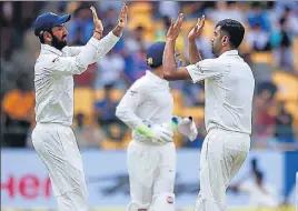  ?? PTI ?? R Ashwin celebrates the wicket of Asghar Stanikzai in the first innings in Bangalore on Friday.