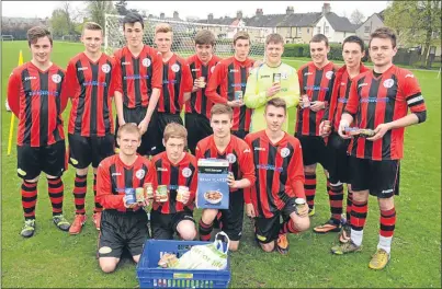  ?? Picture: David Wardle. ?? Rosyth footballer­s with their donations to the foodbank.