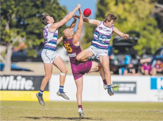  ?? Picture: JERAD WILLIAMS ?? Broadbeach players close down Palm Beach Currumbin's John Anthony during the Lions’ stirring victory at Subaru Oval.