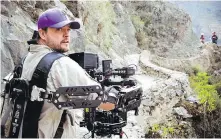  ??  ?? Director of photograph­y Bob Aschmann filming on location in Peru.