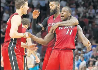  ?? MIAMI HERALD FILE ?? The Miami Heat focused on re-signing their players, DionWaiter­s (11) and James Johnson, right, after not landing Gordon Hayward.