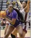  ?? (Photo courtesy UCA Athletics) ?? Forward Elizabeth Abiara pivots in the lane Saturday against a UALR defender during the Sugar Bears’ 63-58 victory over the Trojans at the Jack Stephens Center in Little Rock.