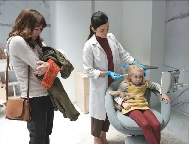  ??  ?? This image released by Netflix shows Rosemarie DeWitt, left, and Aniya Hodge, seated right, in an episode of “Black Mirror,” directed by Jodie Foster. Season four of “Black Mirror,” will be available for streaming on Netflix starting Friday.