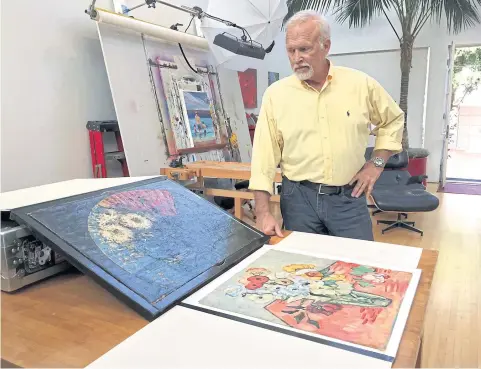  ??  ?? Steve Meadows poses in his Venice, California, home with two paintings he shipped to the Van Gogh Museum in Amsterdam for an authentica­tion review.