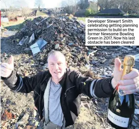  ??  ?? Developer Stewart Smith celebratin­g getting planning permission to build on the former Newsome Bowling Green in 2017. Now his last obstacle has been cleared