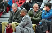  ?? TIM MARTIN/THE DAY ?? Jim Calhoun, left, former UConn mens’ basketball coach and now the head coach/consultant at Division III St. Joseph in West Hartford, sits in the bleachers watching the East Lyme vs. NFA boys’ basketball game Tuesday in Norwich. At right is former...