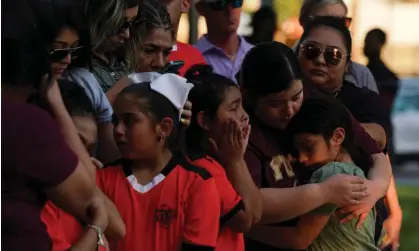  ?? Photograph: Veronica Cardenas/Reuters ?? ‘There have been more mass shootings in the US in 2022 than days of the year.’ People mourn victims of the Robb elementary school mass shooting, in Uvalde, Texas, 26 May 2022.