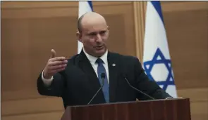  ?? (AP/Maya Alleruzzo) ?? Israeli Prime Minister Naftali Bennett speaks during a joint statement with Foreign Minister Yair Lapid, at the Knesset, Israel’s parliament on Monday in Jerusalem.