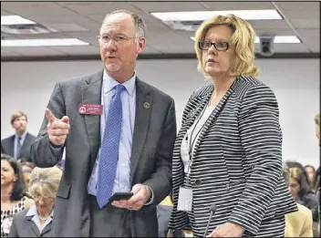  ?? BOB ANDRES / AJC ?? State Rep. Allen Peake (left) confers with Sen. Renee Unterman before a 2015 hearing on House Bill 1, which legalized a limited form of medical marijuana in Georgia. Peake has since been named chairman of the Georgia Medical Cannabis Commission.