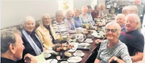  ??  ?? Tea and chat The church group enjoy a cuppa at the Coo Shed