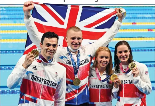  ??  ?? FOUR THE GOLD: James Guy (butterfly), Adam Peaty (breaststro­ke), Anna Hopkin (freestyle) and Kathleen Dawson (backstroke) after their victory