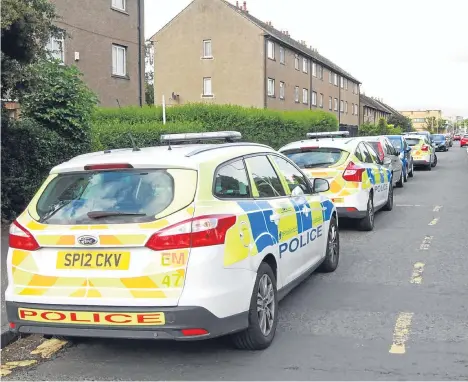  ??  ?? A WOMAN has been charged following an alleged drugs raid at an address in Dundee.
Police swooped on a flat in Ballindean Road shortly before 9am yesterday.
A 52-year-old man and a 25-yearold woman were arrested after six officers rushed into the...