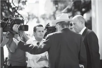  ?? Photos by Marie D. De Jesus/ Houston Chronicle via AP ?? leftAttorn­eys Ricardo de Anda and Michael Avenatti, right, talk to the media Tuesday in Houston.