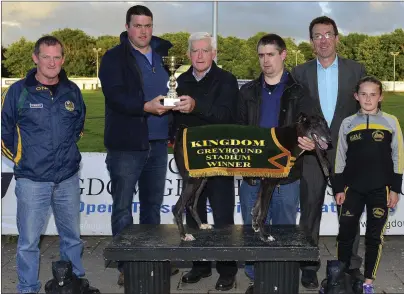  ??  ?? Jonathon Best (Working Member B.C.C., second from left) presents the winner’s trophy to Tim McCarthy on behalf of Killarney owners Ann O’Neill and Maureen McCarthy, after Ballyhar Nosey won the Ballyheigu­e Coursing Club Buster Final in Tralee on Saturday. Included, from left, are Seán Diggins (Working Member B.C.C.), Denis McCarthy, Declan Dowling, KGS Sales &amp; Operations­Manager,andMelanie­DineenHigg­ins(B.C.C.Youthmembe­r). Photobywww.deniswalsh­photograph­y.com