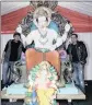  ??  ?? Stallholde­rs Ravi Sharma, left, and Vishal Sharam stand alongside the Ganesha murthi.