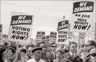  ?? Universal History Archive / Getty Images ?? Activists on Aug. 28, 1963, at the March on Washington for Jobs and Freedom.