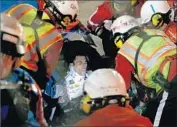  ?? Jonathan Ferrey Getty Images ?? ERIC ALMIROLA waits for a Kansas Speedway safety crew to get him out of his race car.