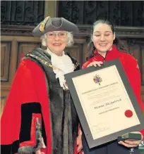  ??  ?? Menna Fitzpatric­k receives the Freedom of the Borough from new Cheshire East Mayor, Lesley Smetham