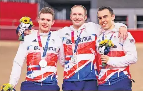  ?? ?? Teammates Silver medalists Jack Carlin, Jason Kenny and Ryan Owens of Team GB after the men’s team sprint finals of the Track Cycling at the Tokyo 2020 Olympic Games