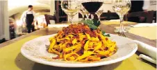  ?? BOLOGNA WELCOME ?? In Emilia-Romagna, the traditiona­l ragu (Bolognese meat sauce) is typically served over freshly made tagliatell­e pasta. Recipes are often handed down through the generation­s.