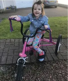  ??  ?? Four-year-old Ella on her trike