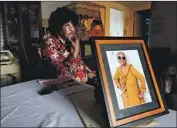  ?? Gary Coronado Los Angeles Times ?? PAULINE COOPER with a photo of Thelma Smith, who must leave her Ladera Heights home by June 30.