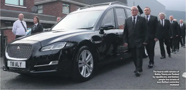  ?? PACEMAKER ?? The hearse with remains of
Bobby Storey are flanked by republican­s, and (below)
people line streets of west Belfast yesterday