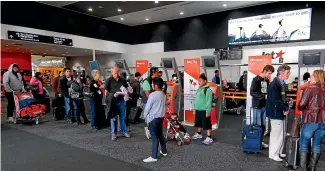  ?? MICHAEL FIELD ?? Jetstar flights out of Auckland and Christchur­ch were held up by long lines at security.