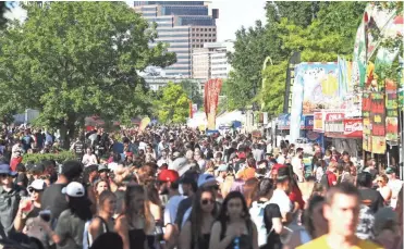  ??  ?? Fans mill around Sunday at the 2019 Beale Street Music Festival, part of the Memphis in May Internatio­nal Festival at Tom Lee Park in Downtown Memphis. BRAD VEST/THE COMMERCIAL APPEAL