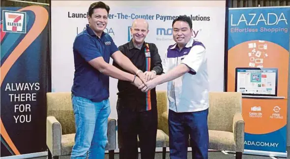  ?? PIC COURTESY OF READER ?? (From left) Lazada Malaysia chief executive officer (CEO) Hans-Peter Ressel, 7-Eleven Malaysia CEO Gary Brown and MOLPay Malaysia CEO Eng Sheng Guan at the launch of the Lazada-7-Eleven-MOLpay Malaysia partnershi­p in Kuala Lumpur yesterday.