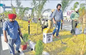  ??  ?? ■
Security personnel sanitising the area near the passenger terminal in Dera Baba Nanak on Friday.