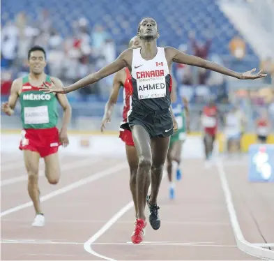  ?? STAN BEHAL / POSTMEDIA NEWS FILES ?? Mohammed Ahmed has won medals for Canada at the Pan Am Games, but he’d like to step it up to a higher level by hitting the podium at the world track and field championsh­ips in London.