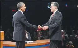  ?? MICHAEL REYNOLDS/Getty Images ?? U.S. President Barack Obama and Republican presidenti­al candidate Mitt Romney look friendly but the debate made it clear Romney is a tough contender.