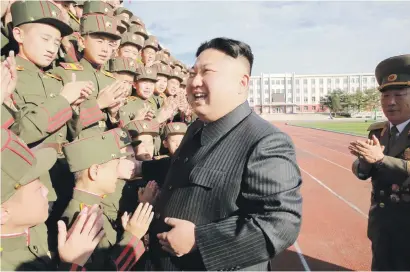  ?? Picture: Reuters ?? TRAINEE REVOLUTION­ARIES. North Korea’s leader Kim Jong Un visits the Mangyongda­e Revolution­ary Academy on its 70th anniversar­y.