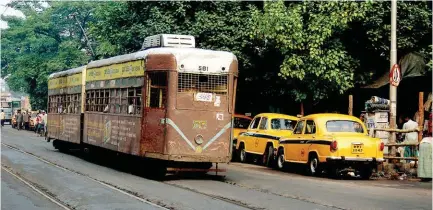  ??  ?? From top: St Paul’s Cathedral is noted for its Gothic architectu­re; trams and yellow ambassador cabs epitomise Kolkata; Howrah Bridge is one of the most recognisab­le symbols of the city.