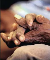  ??  ?? POWER OF LOVE. The hands of an old man attending a meeting on plans for his community. The elderly may be surprised at some of the new cures for dementia.